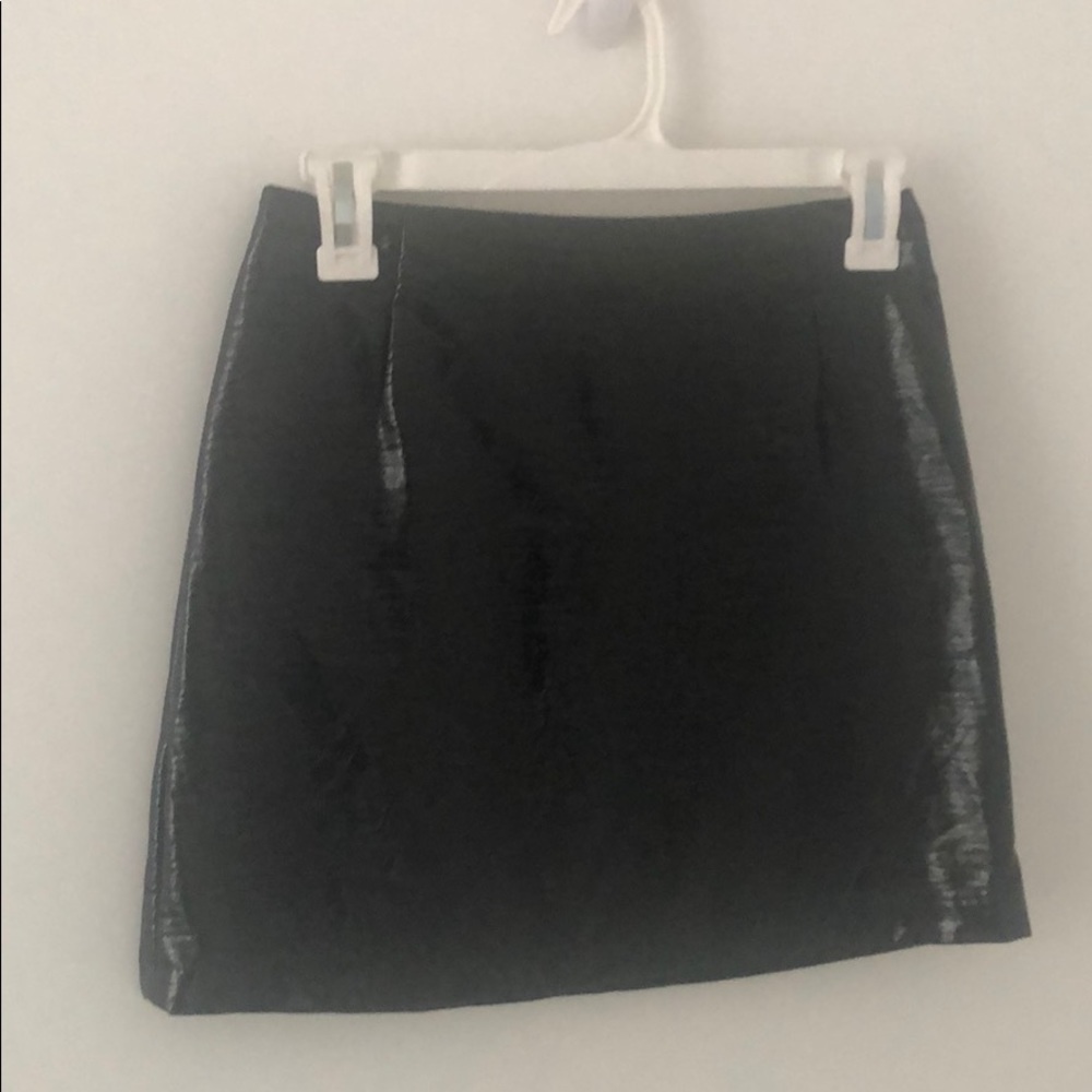 Shiny black leather mini skirt